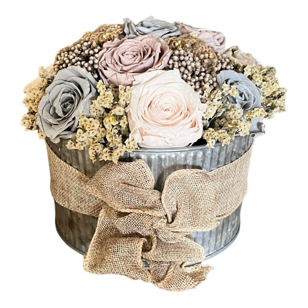 A bouquet of flowers in a round box