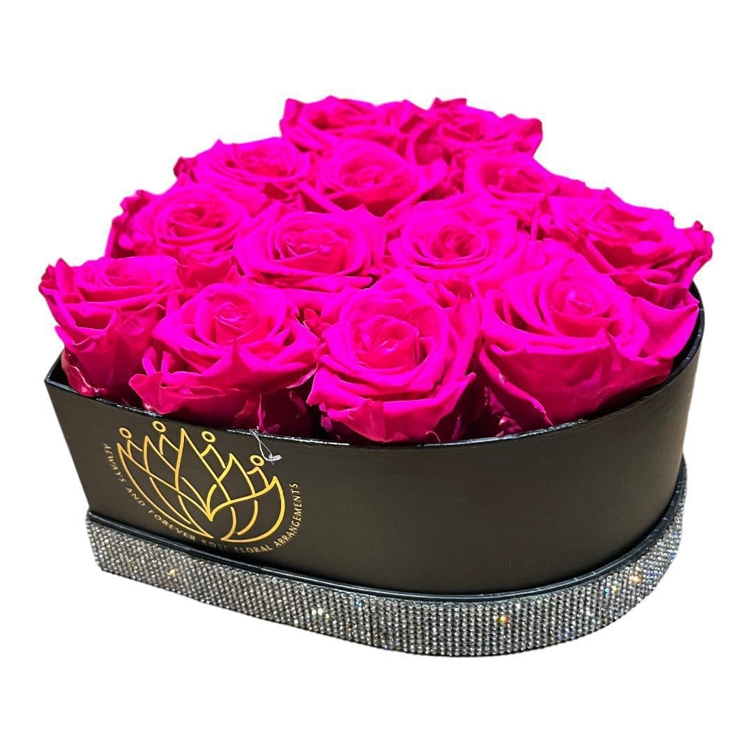 A black box with pink roses inside of it
