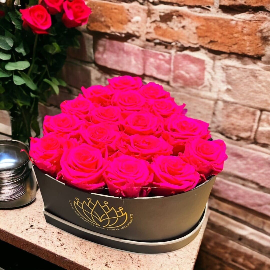 A bunch of pink roses in a bowl