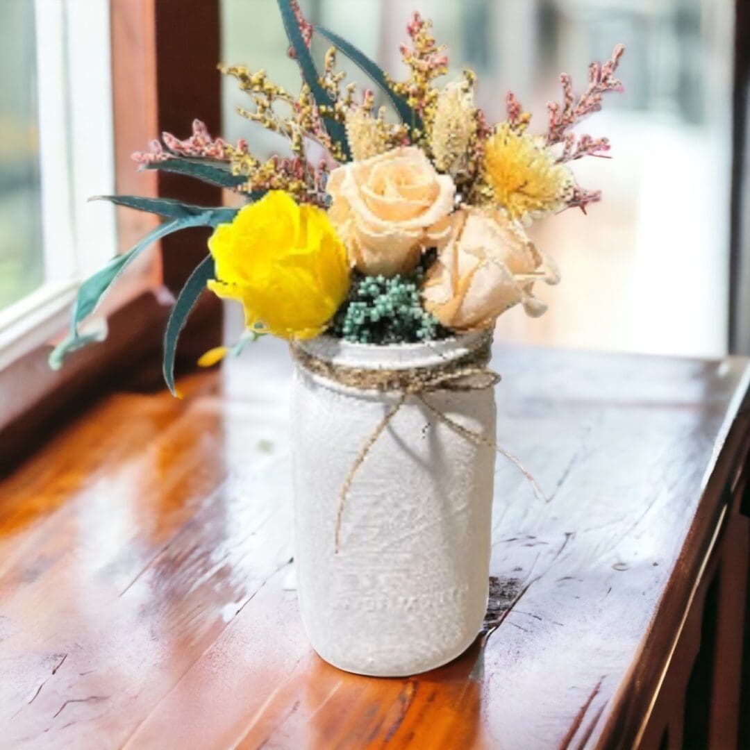 A vase with flowers on top of a table.