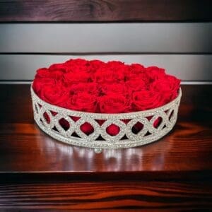A bowl of roses on top of a table.