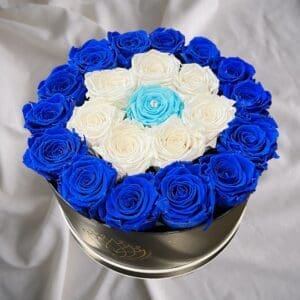 A round box of blue and white roses