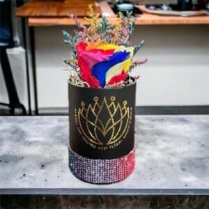 A vase with flowers in it sitting on top of a table.