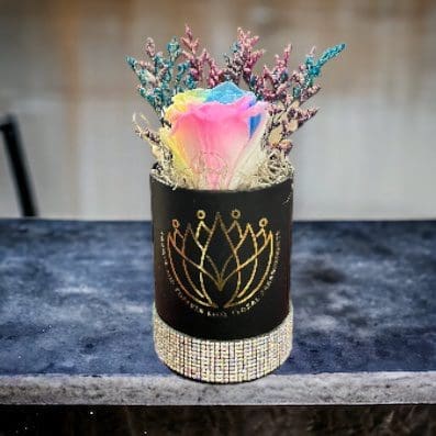 A vase with some flowers in it on top of a table
