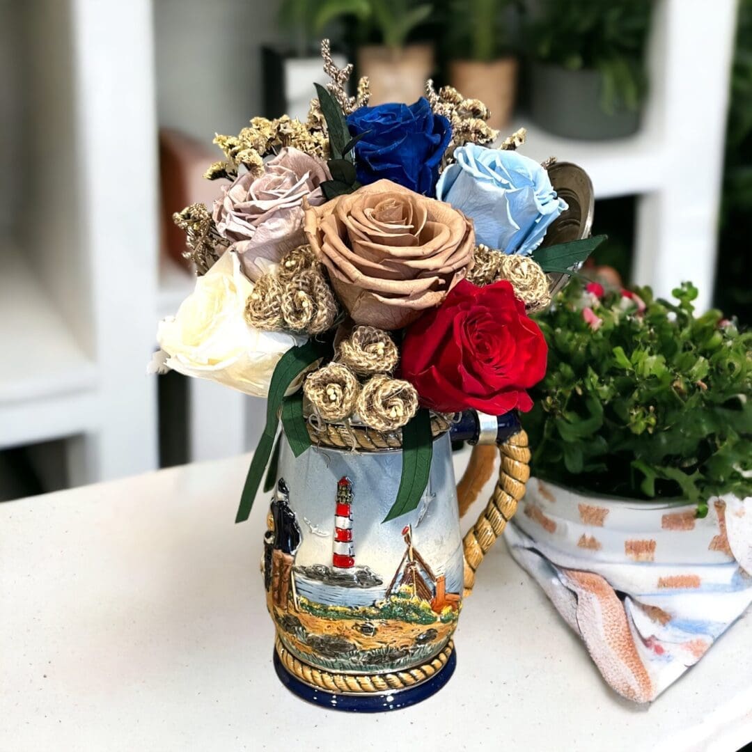 A vase with roses in it on top of a table.