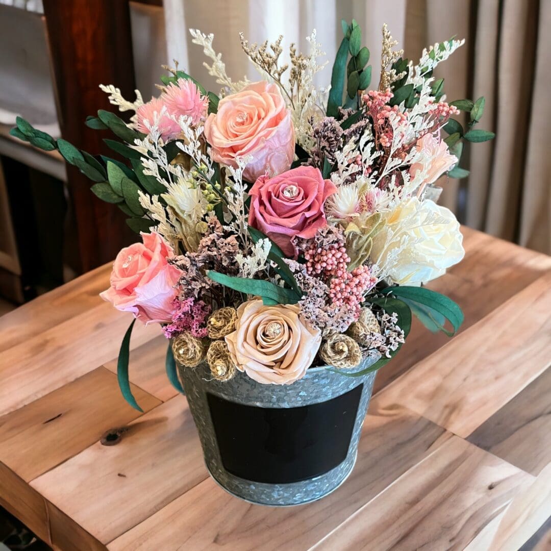 A wooden table with flowers in it