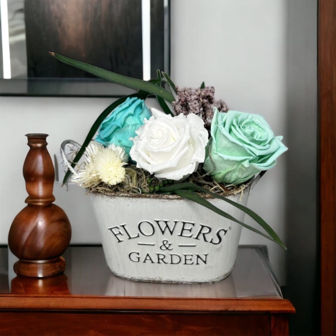A vase with flowers on top of a table.